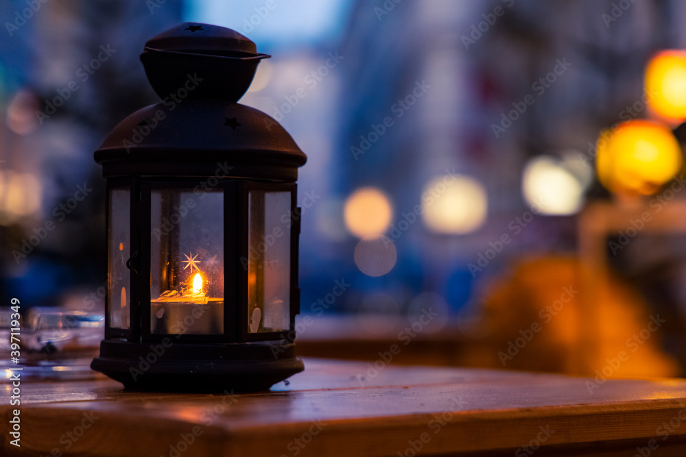 Christmas lantern decoration object on table evening twilight lighting outdoor street environment space with blurred background view garland lamps lights Christmas lantern decoration object on table evening twilight lighting outdoor street environment space with blurred background view garland lamps lights