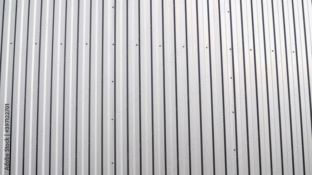 White Corrugated metal sheet surface of the wall. Galvanize steel background. White Corrugated metal sheet surface of the wall. Galvanize steel background.