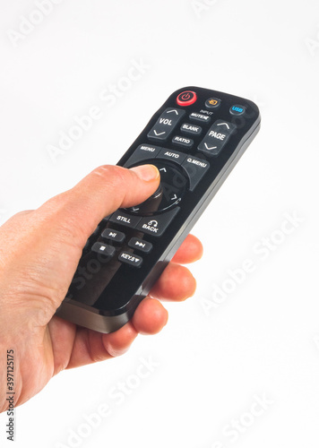 hand holding a remote control on white background, close-up