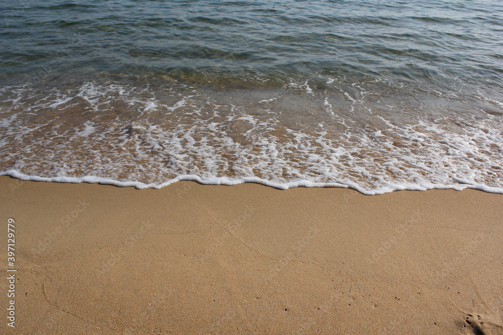 Soft beautiful ocean wave on sandy beach. Background Soft beautiful ocean wave on sandy beach. Background