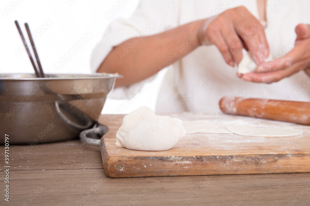 The Chinese make dumplings for traditional festivals in the kitchen