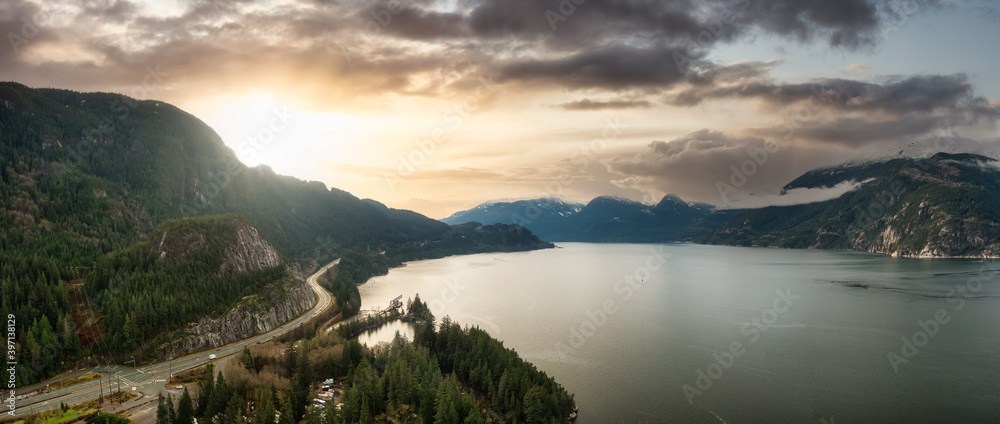 Sea to Sky Hwy in Howe Sound near Squamish, British Columbia, Canada. Aerial panoramic View. Beautiful Sunny and Cloudy Morning Sky Art Render.