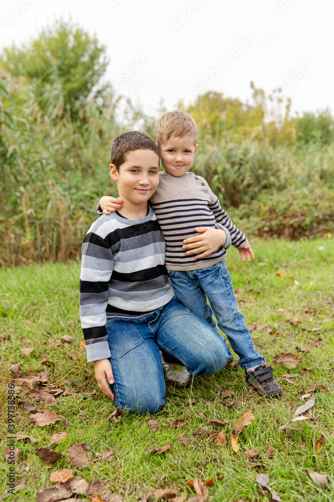 Little brothers embracing and laughing. Love, trust and tenderness Little brothers embracing and laughing. Love, trust and tenderness