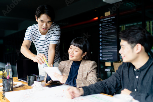 Asian business people planning startup project together. photo