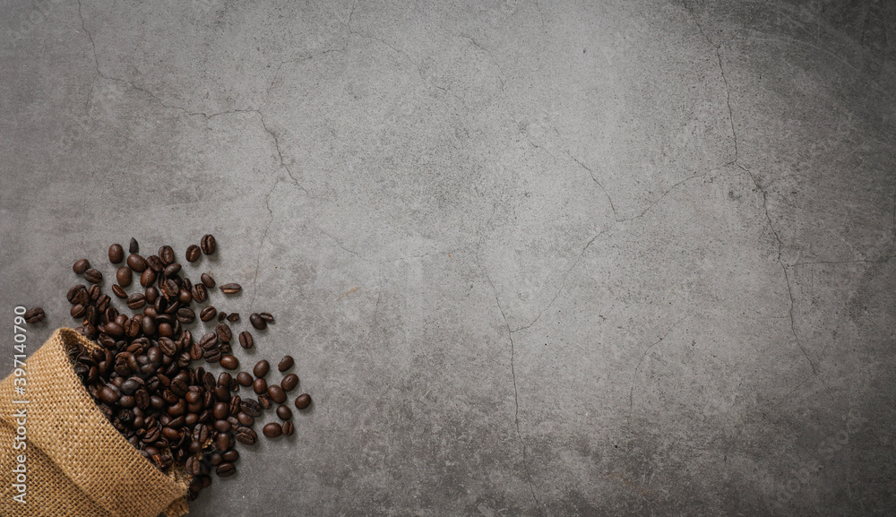 Coffee cup and beans on old kitchen table. Top view with copyspace for your text Coffee cup and beans on old kitchen table. Top view with copyspace for your text