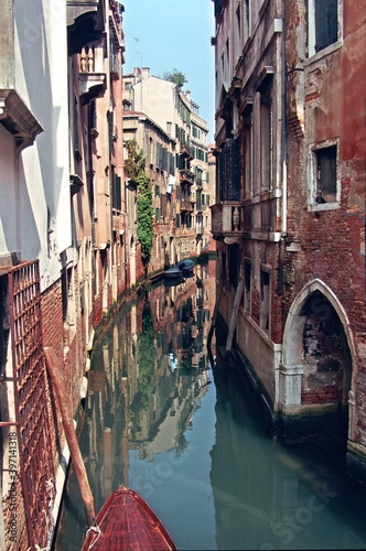 View of the narrow Canal and the colorful Venetian houses along the canal in Venice, Italy.