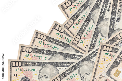 10 US dollars bills lies in different order isolated on white. Local banking or money making concept photo