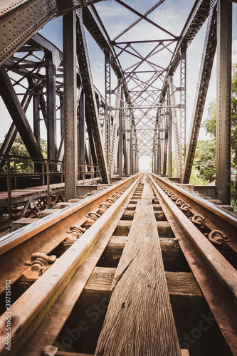 Old steel railway bridge over the pranburi river in thailand