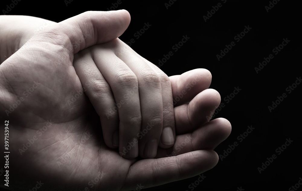 Closeup of Man and Woman Holding Hands