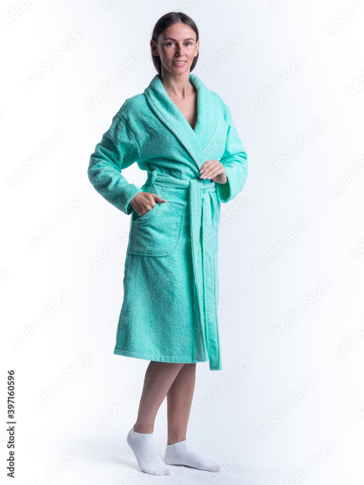 woman in a Bathrobe on an isolated white background with a smile on her face. woman in a Bathrobe on an isolated white background with a smile on her face.