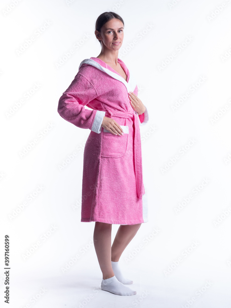 woman in a Bathrobe on an isolated white background with a smile on her face. woman in a Bathrobe on an isolated white background with a smile on her face.