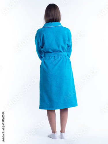 woman in a dressing gown from the back on an isolated white background.