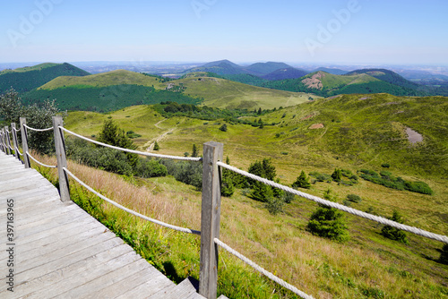Stairs wooden pathway trail access of the Puy de Dome volcano mountain in france
