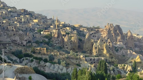 Guvercinlik Valley and town at Cappadocia, Turkey. Attraction point and popular touristic place for tourist and tour company. Fairy chimneys, sandstones at national park. Old rocks and limestones.