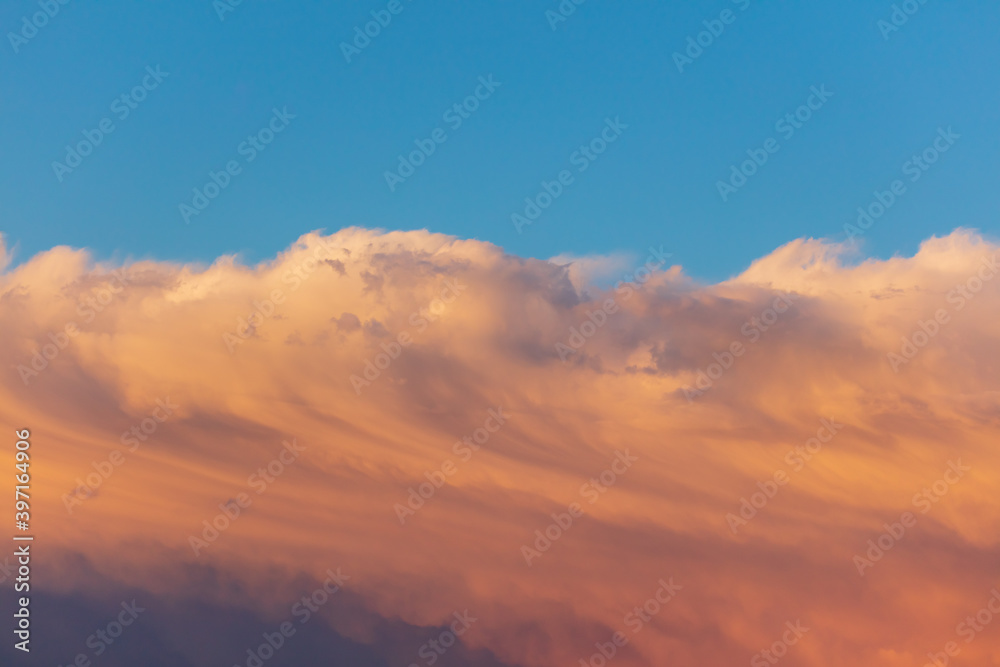Obraz premium Colorful clouds at sunset as background.