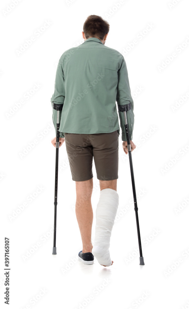 Young man with broken leg on white background Young man with broken leg on white background