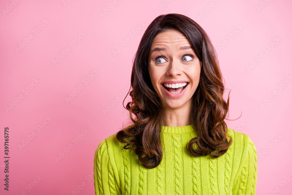 Photo of excited shocked girl open mouth look side empty space wear green sweater isolated pink color background Photo of excited shocked girl open mouth look side empty space wear green sweater isolated pink color background