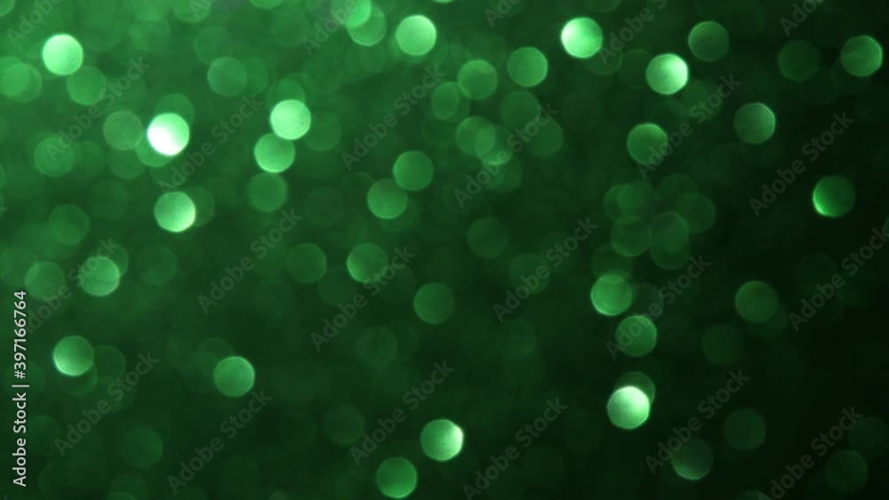 green bokeh moving through and black background green bokeh moving through and black background