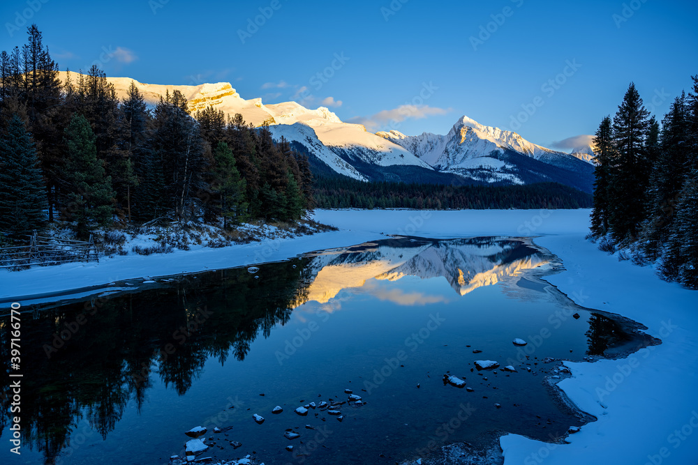 Maligne Lake at Sunset in winter beautiful reflection, Jasper National Park, Alberta Canada