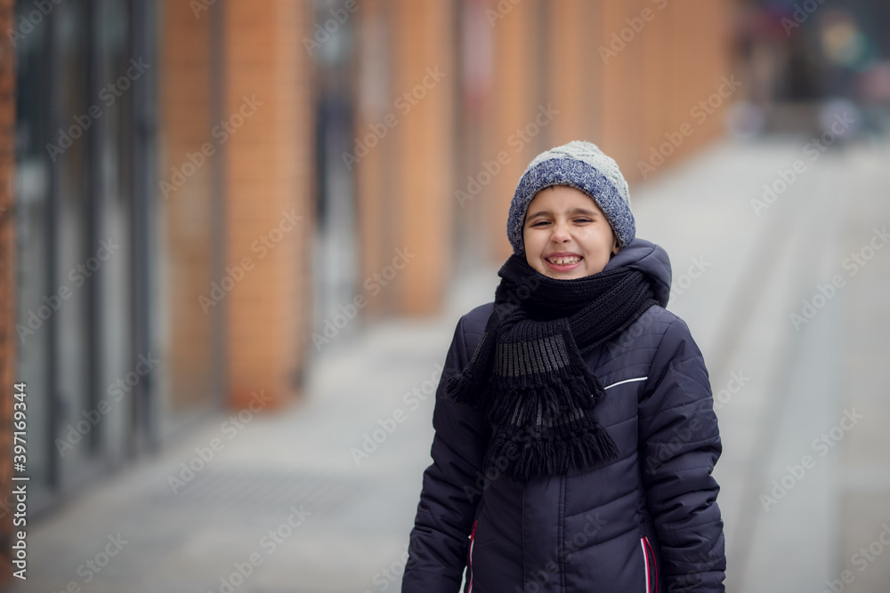 Winter portrait of a happy smile boy in hat. Christmas time. Snowdrift, cold. Happy new year. Winter holidays in the forest with snow Winter portrait of a happy smile boy in hat. Christmas time. Snowdrift, cold. Happy new year. Winter holidays in the forest with snow