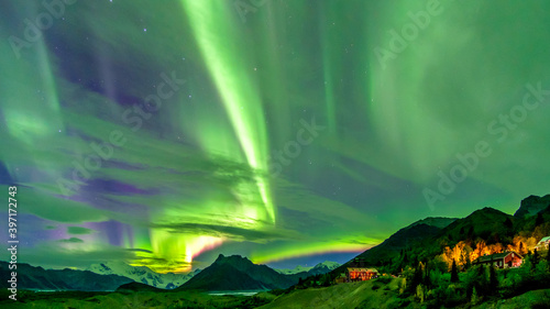 Northern lights over valley. Dancing sky. photo