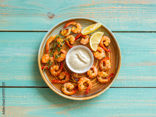 Fried shrimp with thyme, lemon and white sauce. Healthy eating. Diet. Sea food.