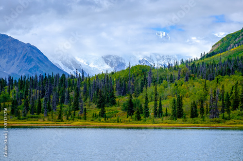Fototapeta Naklejka Na Ścianę i Meble -  Hike to Donoho lakes, after crossing Root Glacier. Mt. Blackburn in the background. Kennicott, Alaska.