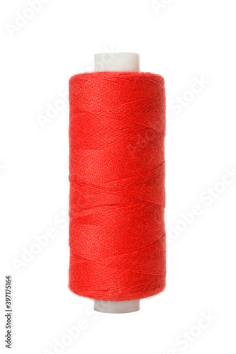 Red spool of thread isolated on white background