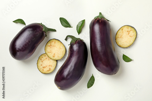 Concept of raw vegetables with eggplants on white background