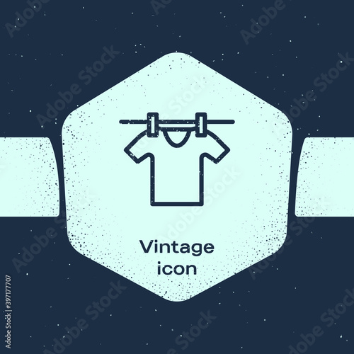 Grunge line Drying clothes icon isolated on blue background. Clean shirt. Wash clothes on a rope with clothespins. Clothing care and tidiness. Monochrome vintage drawing. Vector.