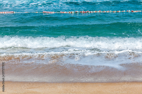 Beach and a buoy line photo