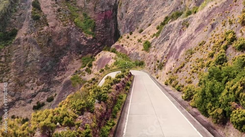 Drone shot of a road leading the coast of Atlantic Ocean in São Miguel Island, Azores, Portugal photo