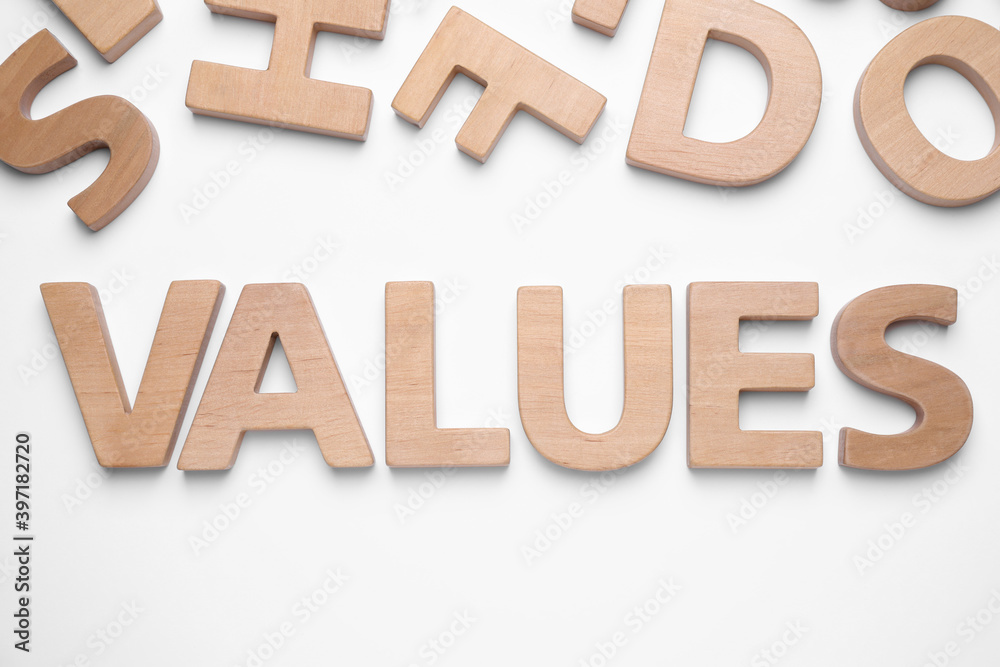 Word VALUES made of wooden letters on white background, top view Word VALUES made of wooden letters on white background, top view