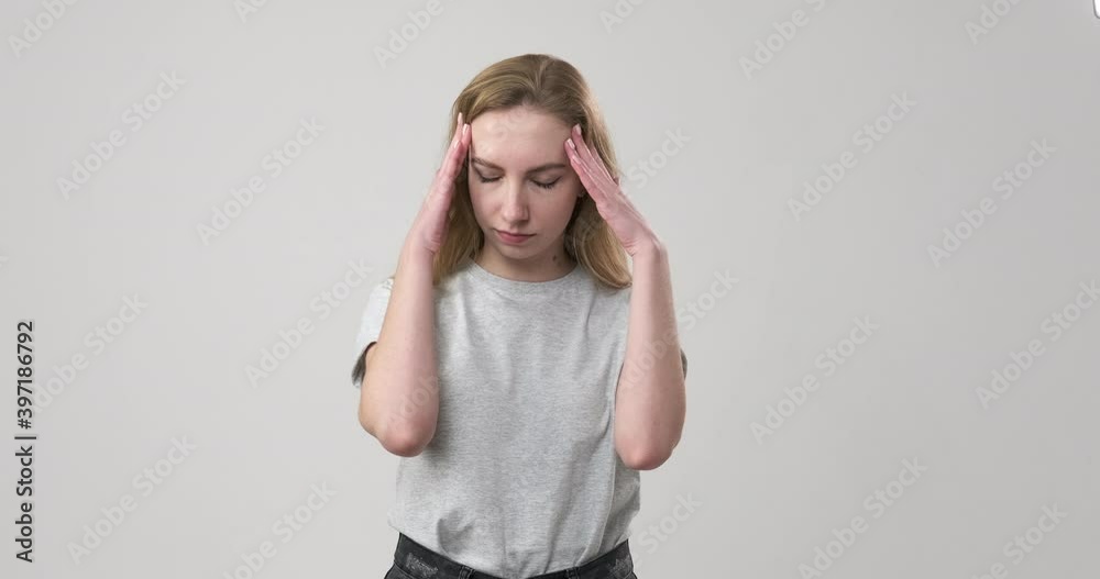 Woman puzzled by fate regretting her deeds over white background Woman puzzled by fate regretting her deeds over white background