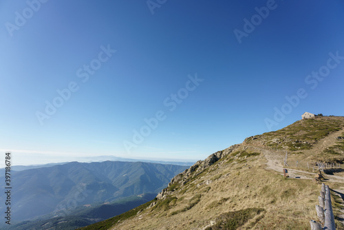 Panoramic views from the top of the "turo de l'home" in the Montseny natural park, in Catalonia. Sunny day with low fog below the top of the mountain