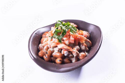 foul or ful Modammas Fava Beans Traditional Dish of Beans for all arab - White background 

