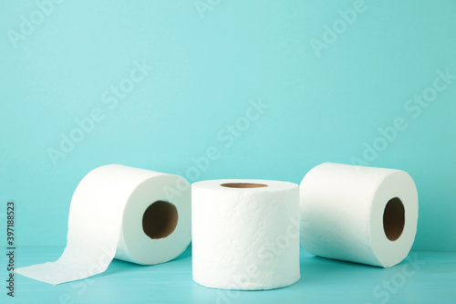 Toilet paper close-up on blue background with copy space