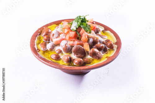 foul or ful Modammas Fava Beans Traditional Dish of Beans for all arab - White background 
 photo