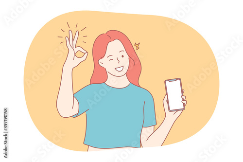 Online communication, thumbs up, smartphone concept. Young smiling girl showing smartphone screen with white mockup for text or lettering and ok good sign with fingers vector illustration 