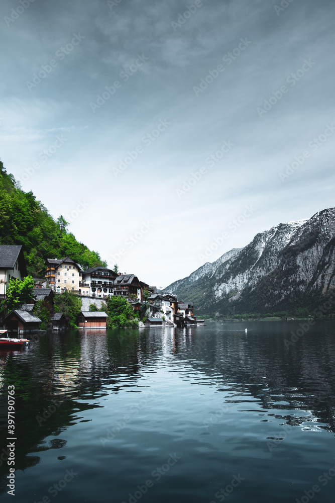 View of buildings along the coastline. View of the mountains and monuments of the city. Hallstatt, Austria.