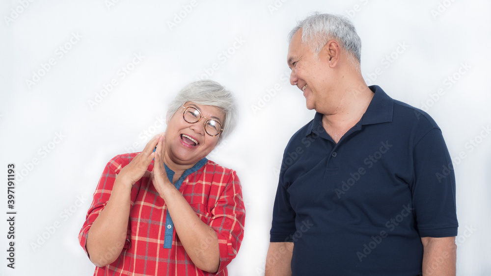 Two happy elderly couple laughing with happiness on white background Two happy elderly couple laughing with happiness on white background