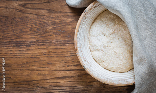 The process of raising the dough in a special basket.Banneton. Dough made from natural sourdough. Wheat dough. Fermentation.