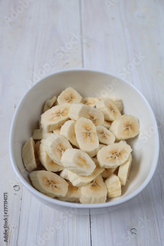 Irisan Pisang. Banana slices in a bowl to make dessert.