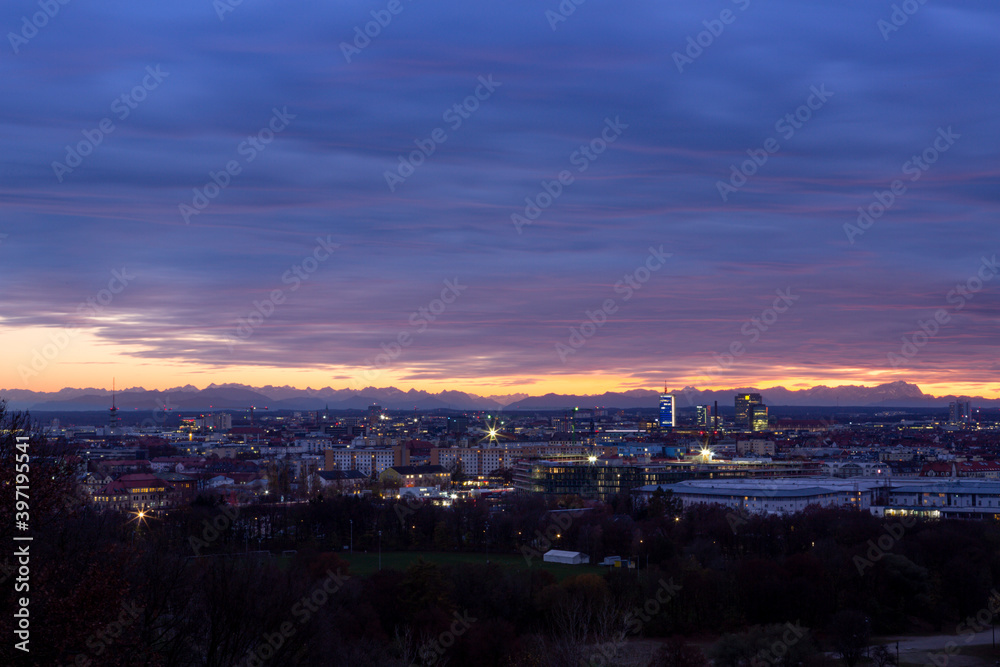 Panorama of downtown Munich during a cloudy autumn season sunset.