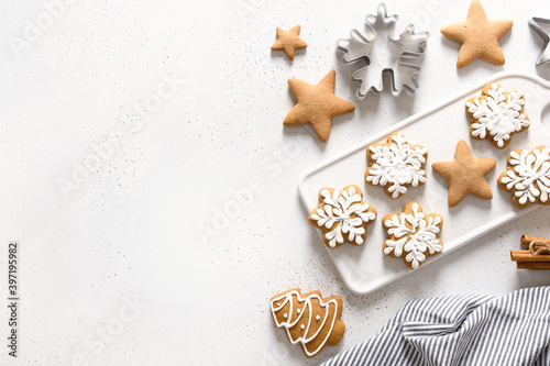 Christmas homemade glazed cookies on white background. View from above. Flat lay. Space for text.