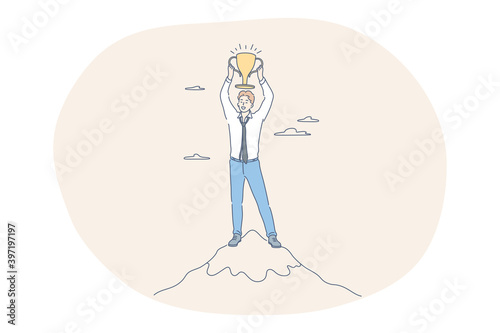Success, leadership, business development concept. Happy young businessman cartoon character standing on peak on hill holding golden trophy and feeling excited with successful project realisation