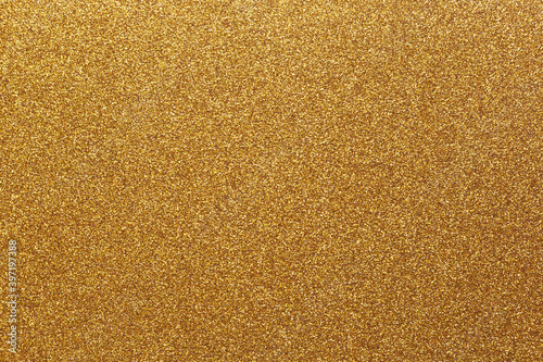 Abstract gold shiny background with copy space. Sparkling texture