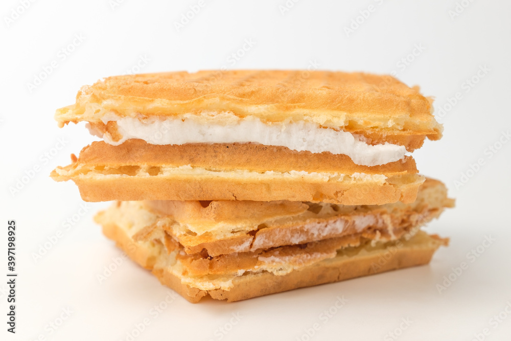 Waffles with cream on a white background Waffles with cream on a white background