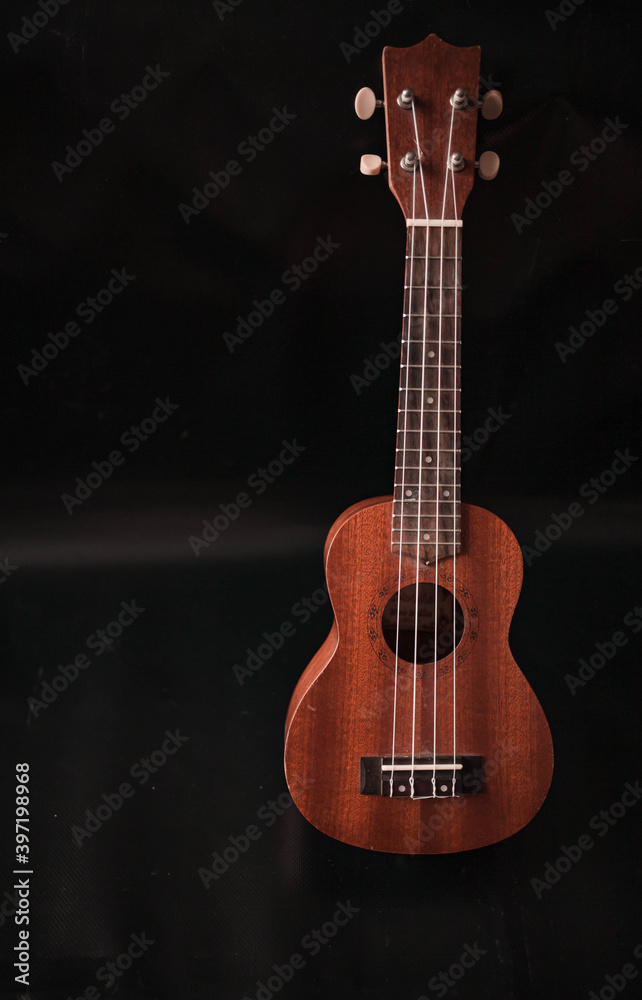 ukulele on a black background