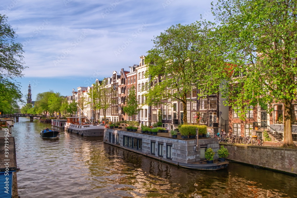 Typical buildings and canal in Amsterdam by day, Netherlands